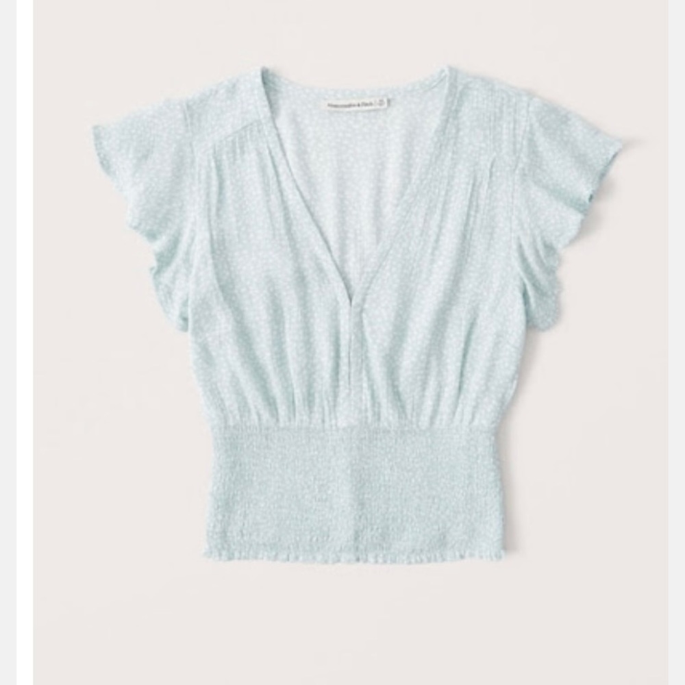 Brand new Short sleeve smocked waist flutter sleeve blouse light blue pattern